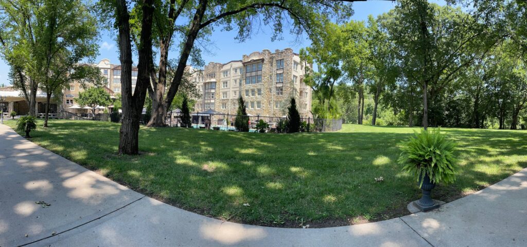 Historic Elms Hotel and Spa in Excelsior Springs, Missouri, surrounded by trees and green space