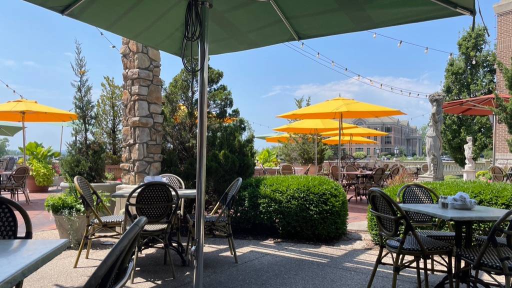Outdoor patio with umbrellas on a sunny day in Columbia, Missouri