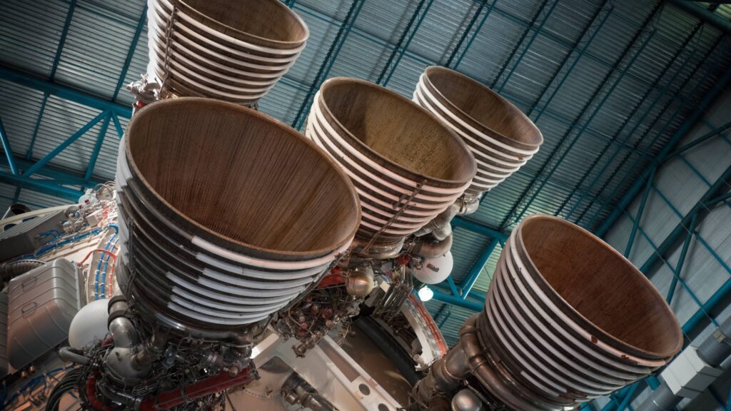 Close-up of clustered Saturn V rocket F-1 engine bells at a space museum exhibit